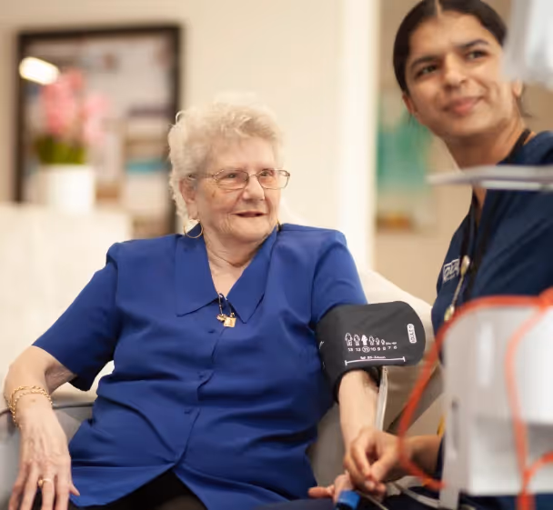 A nurse at our aged care home provides personalised health monitoring and care to ensure resident comfort and well-being.