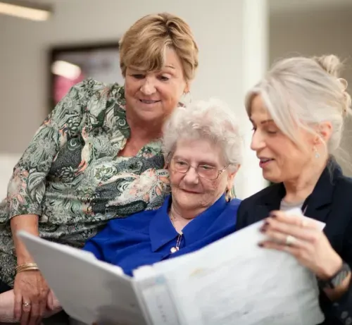 Resident and family reviewing care information together at Oxa Care.