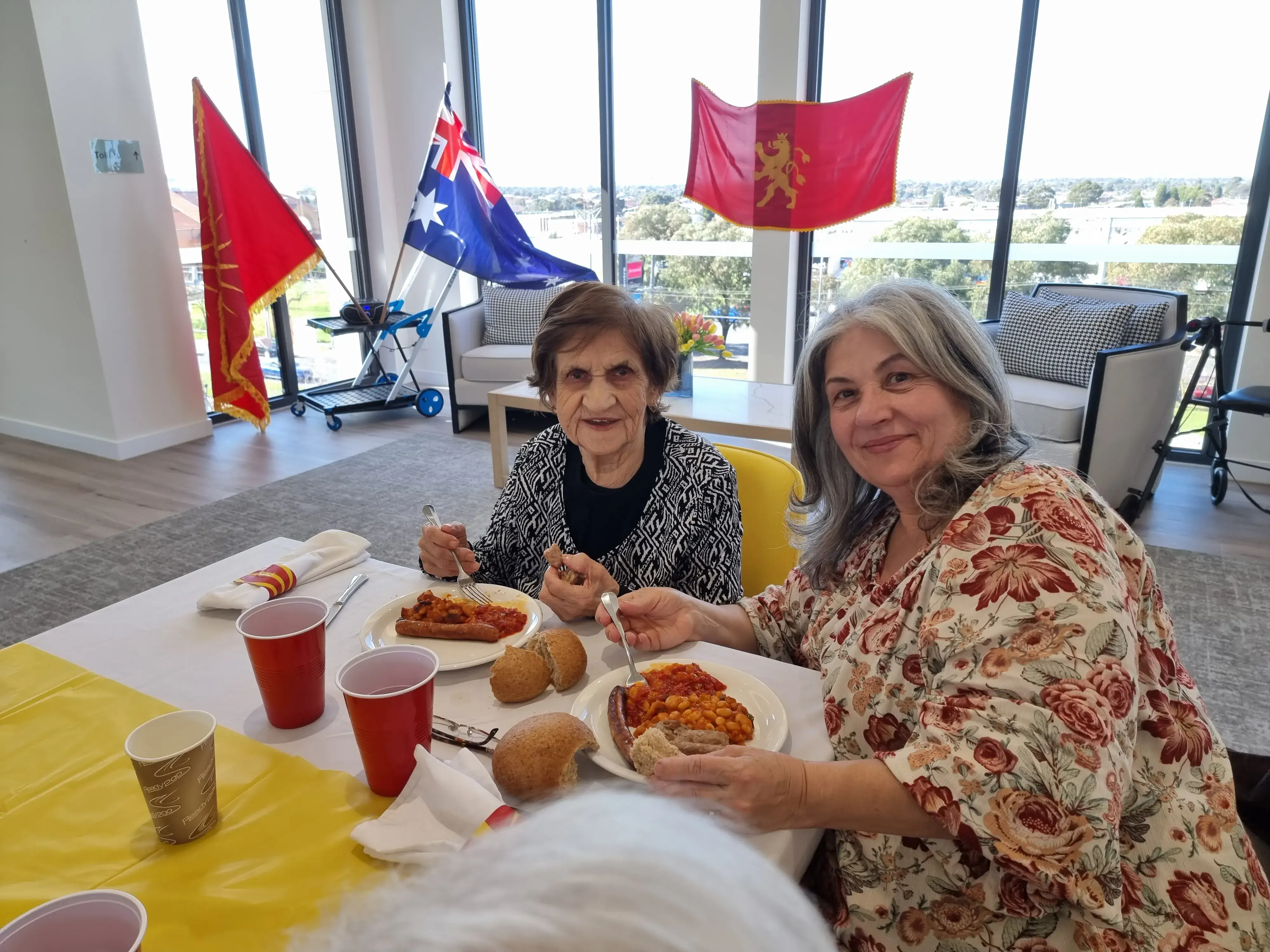 Residents sharing a meal together during a social dining activity.