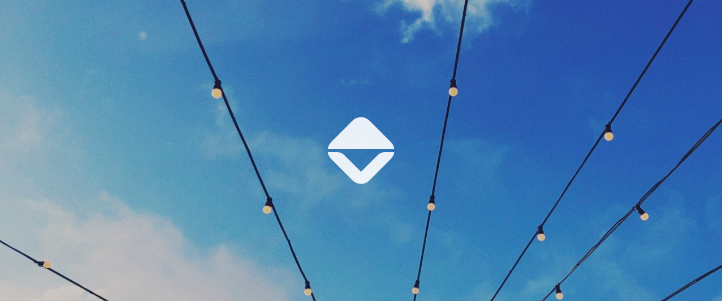 Photo of blue sky with string lights overhead and a centered OpsHelm logomark