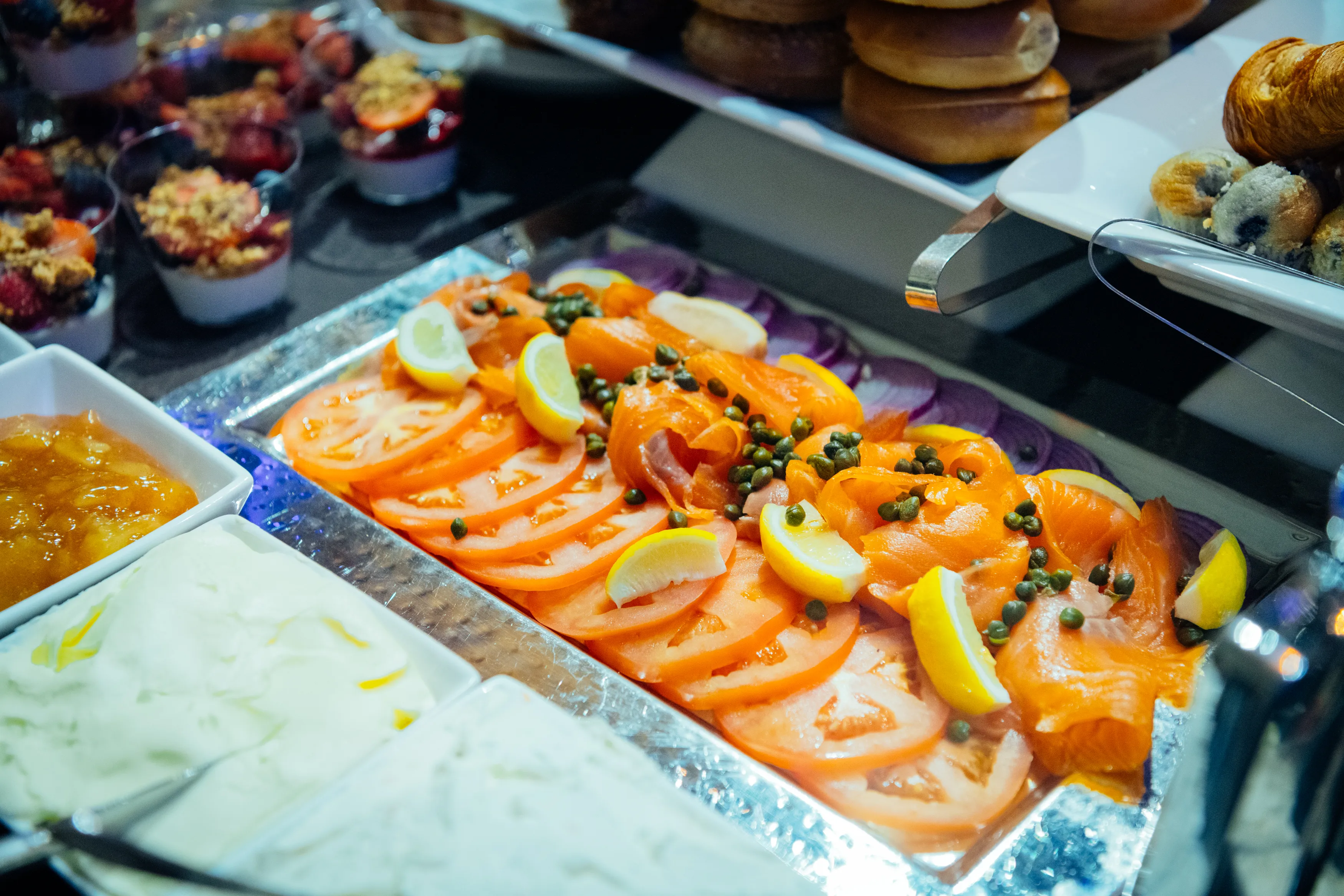 Smoked salmon platter with tomatoes, capers and lemon on the Gotham Hall brunch buffet