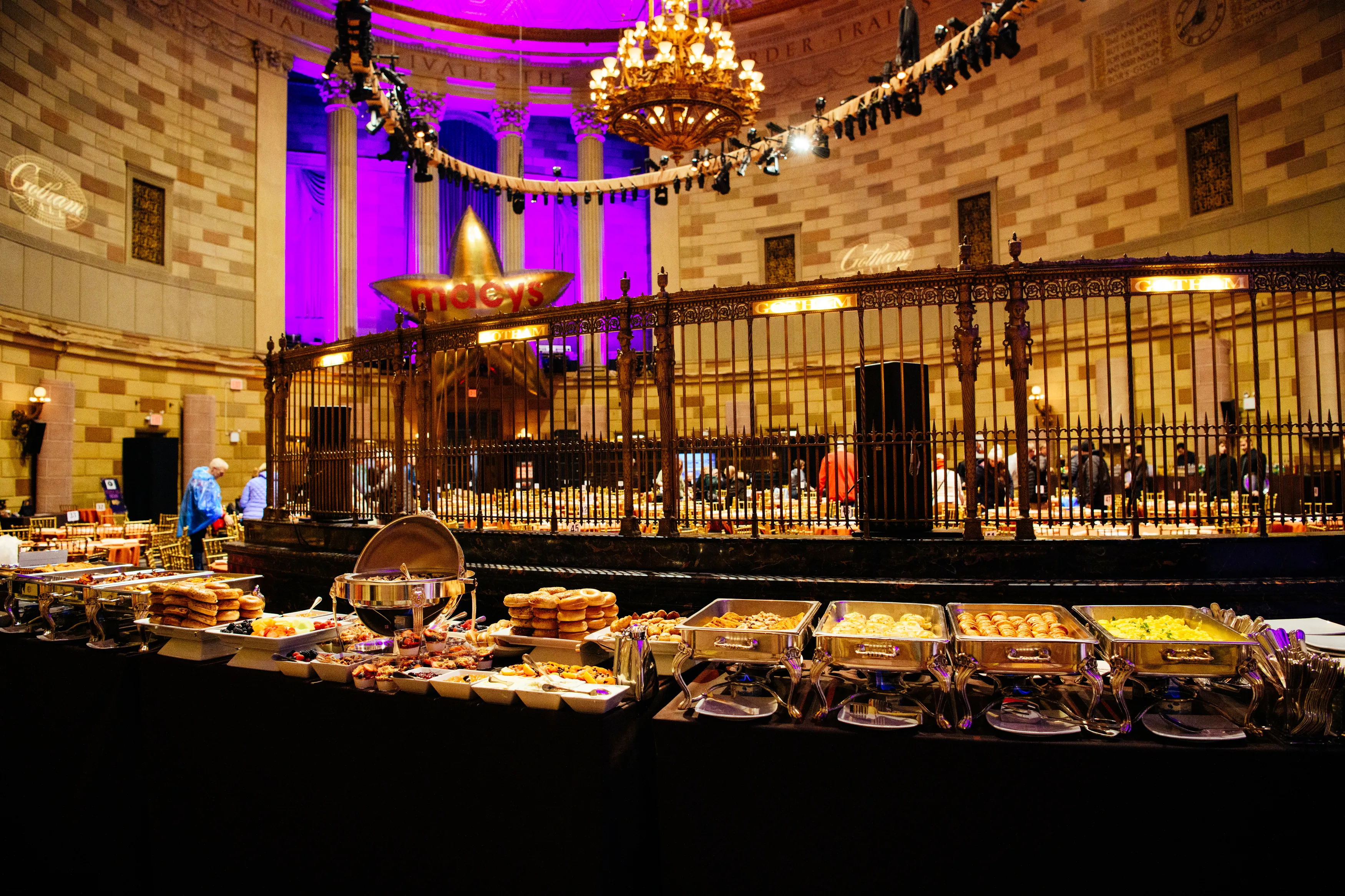 Brunch buffet stations under the chandelier in the Gotham Hall ballroom