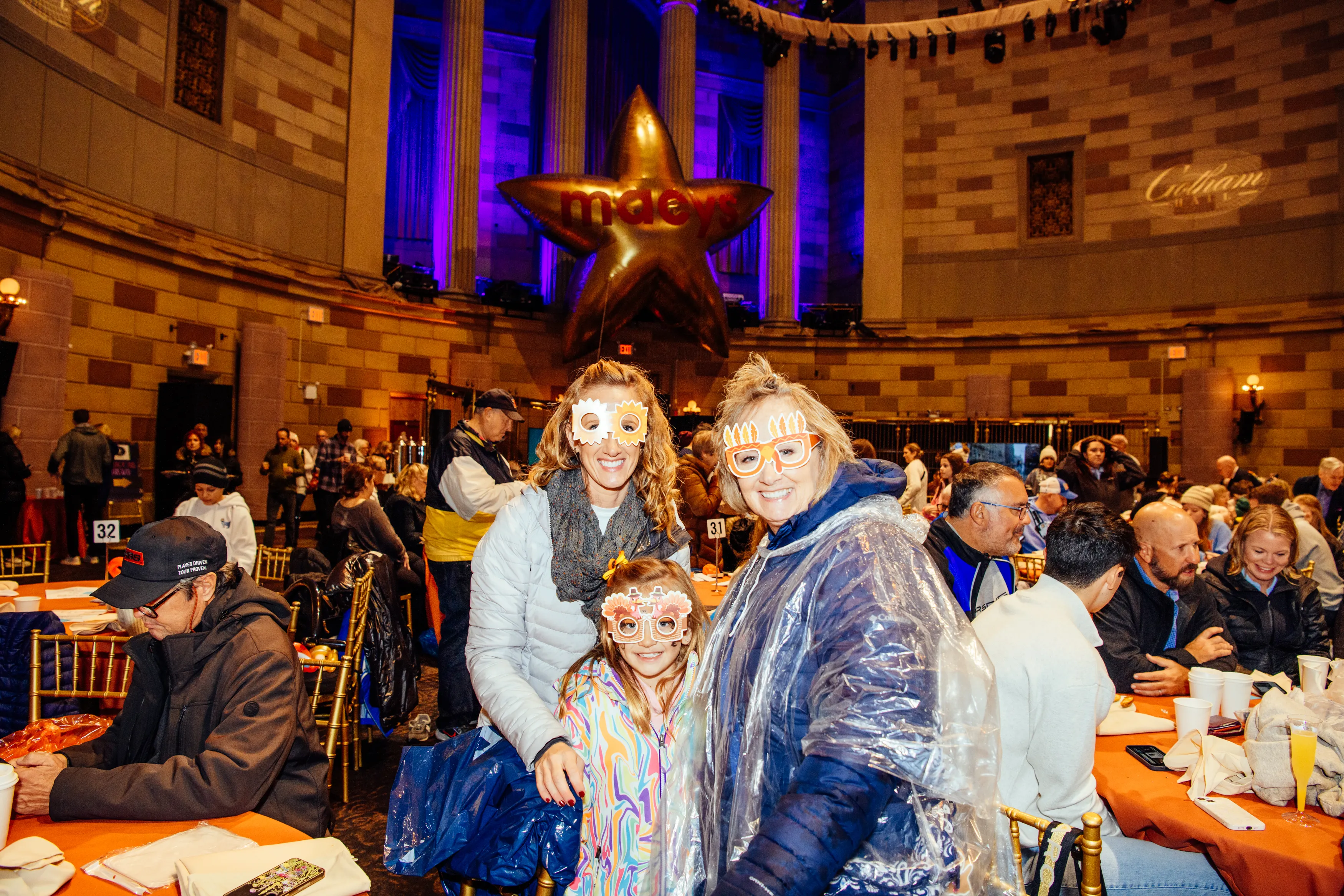 Guests with face paint and masks at the Gotham Hall Thanksgiving brunch