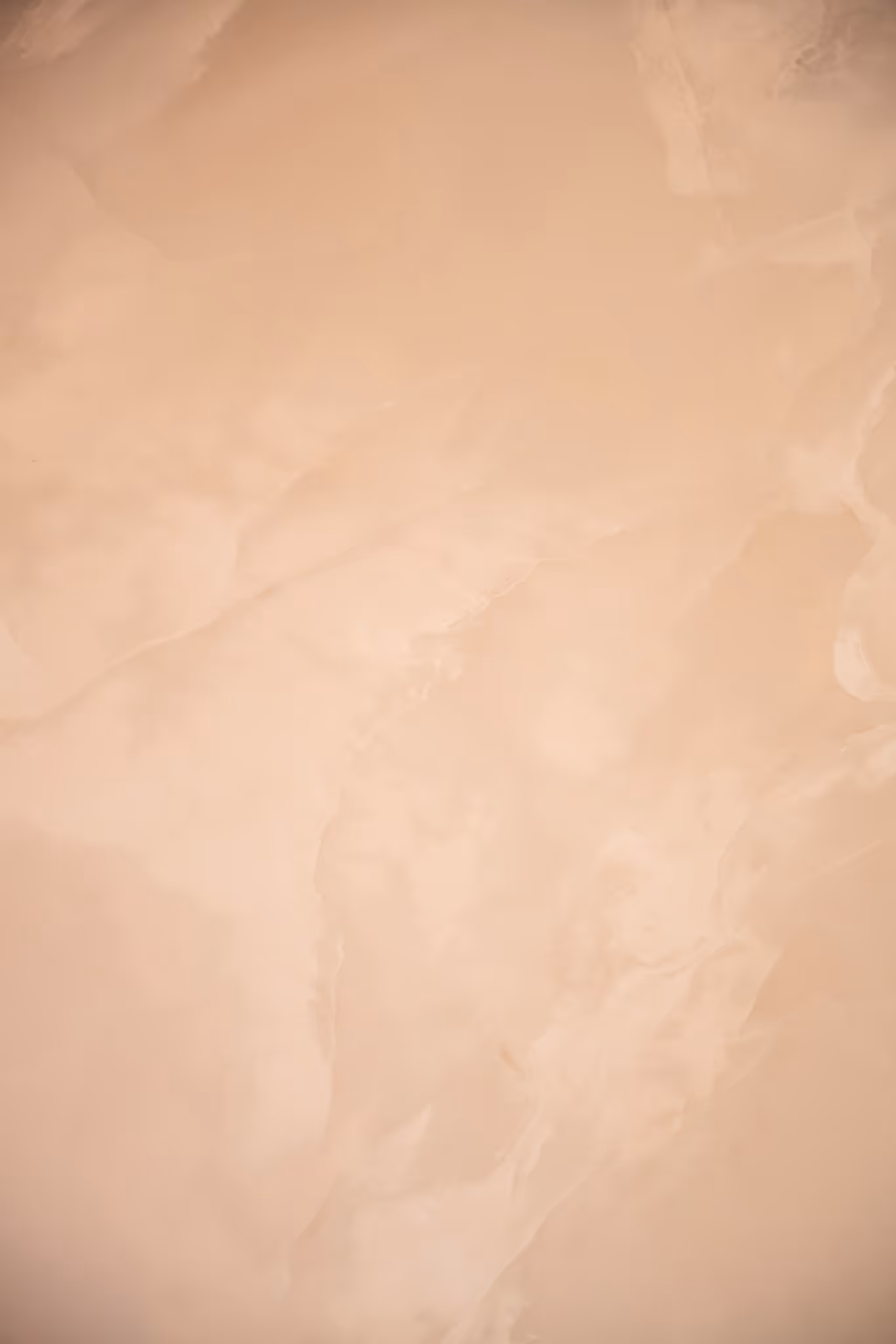 Close-up van een glad, beige, zacht oppervlak.