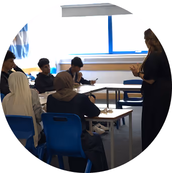 Xcelerate Academy tutor teaching a group of students