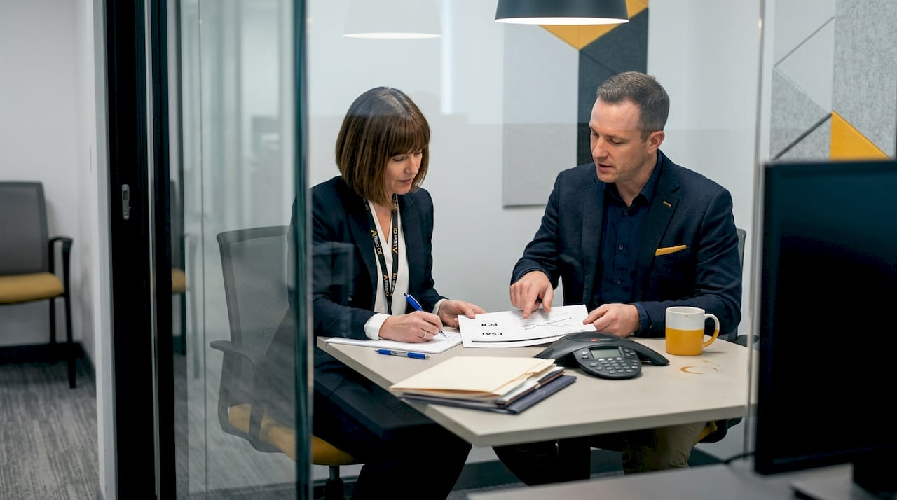 Colleagues discuss FCR and CSAT performance