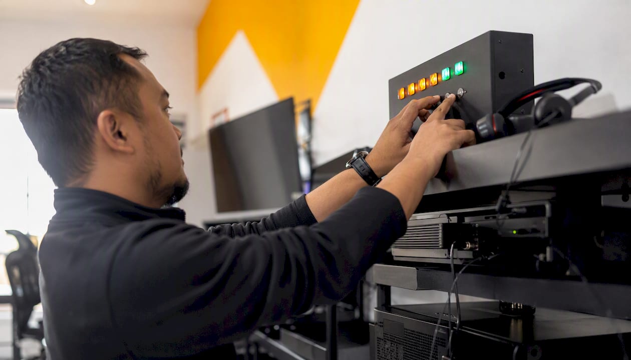 Hands resetting alert panel in CX operations hub