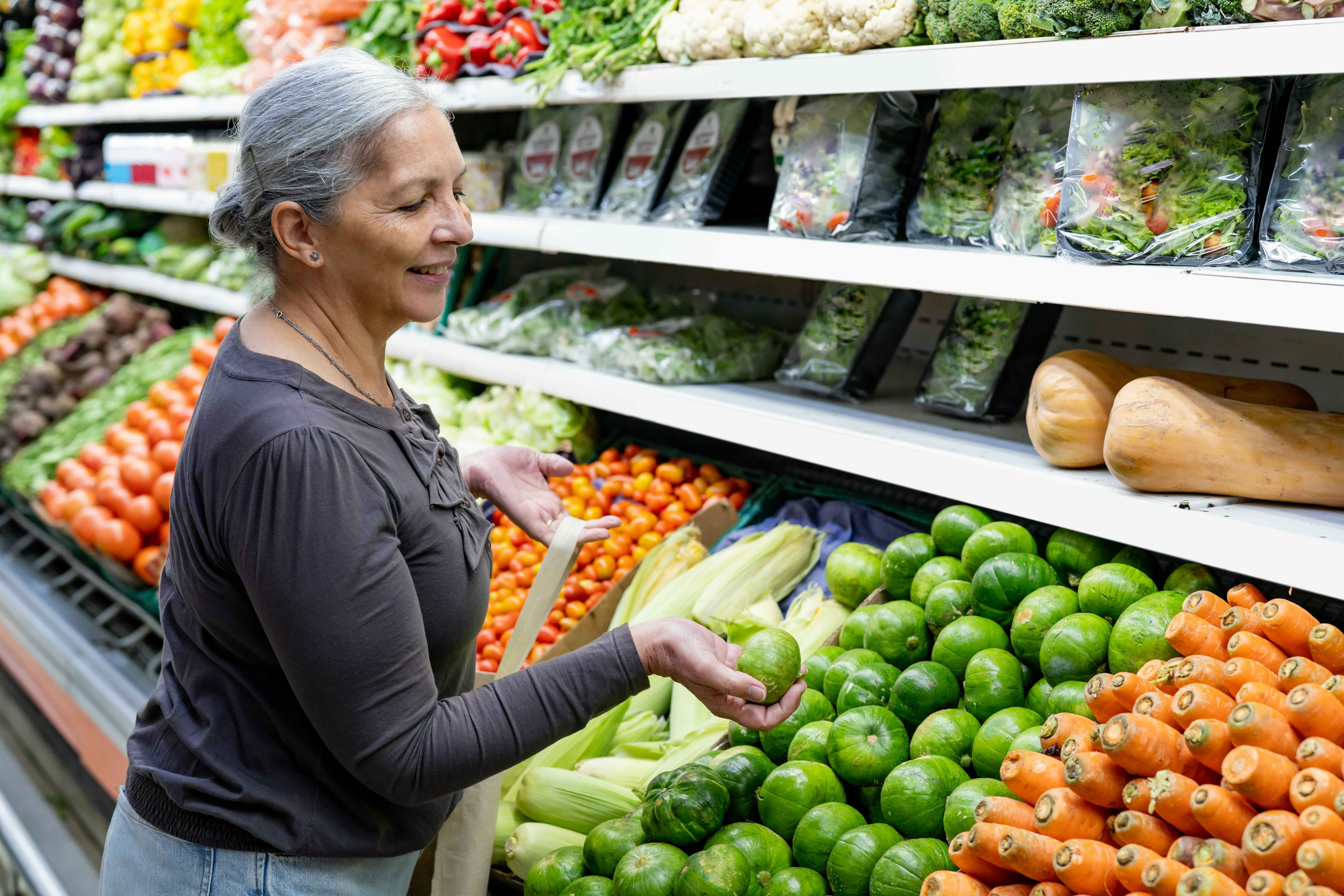 Older woman shopping at a grocery store