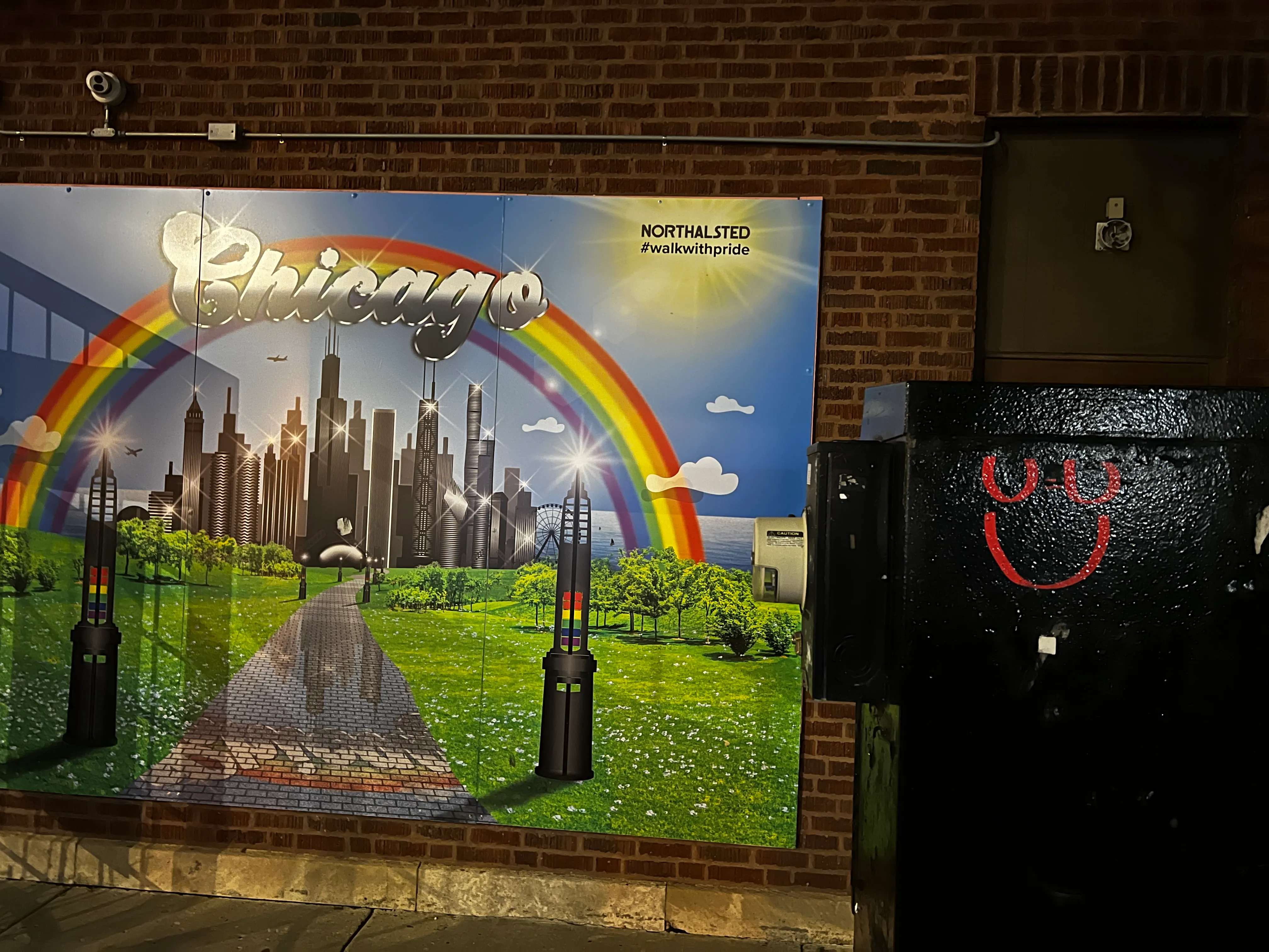 U=U tag on a utility box beside the Northalsted Chicago rainbow mural