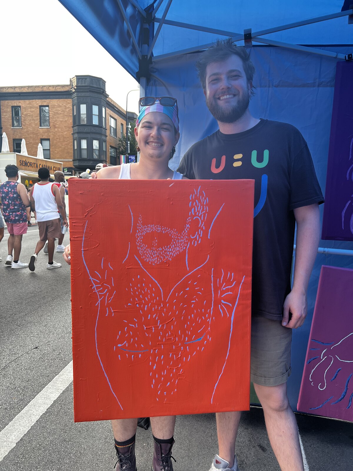 Visitors at the Q.M.M. booth, Northalsted Market Days