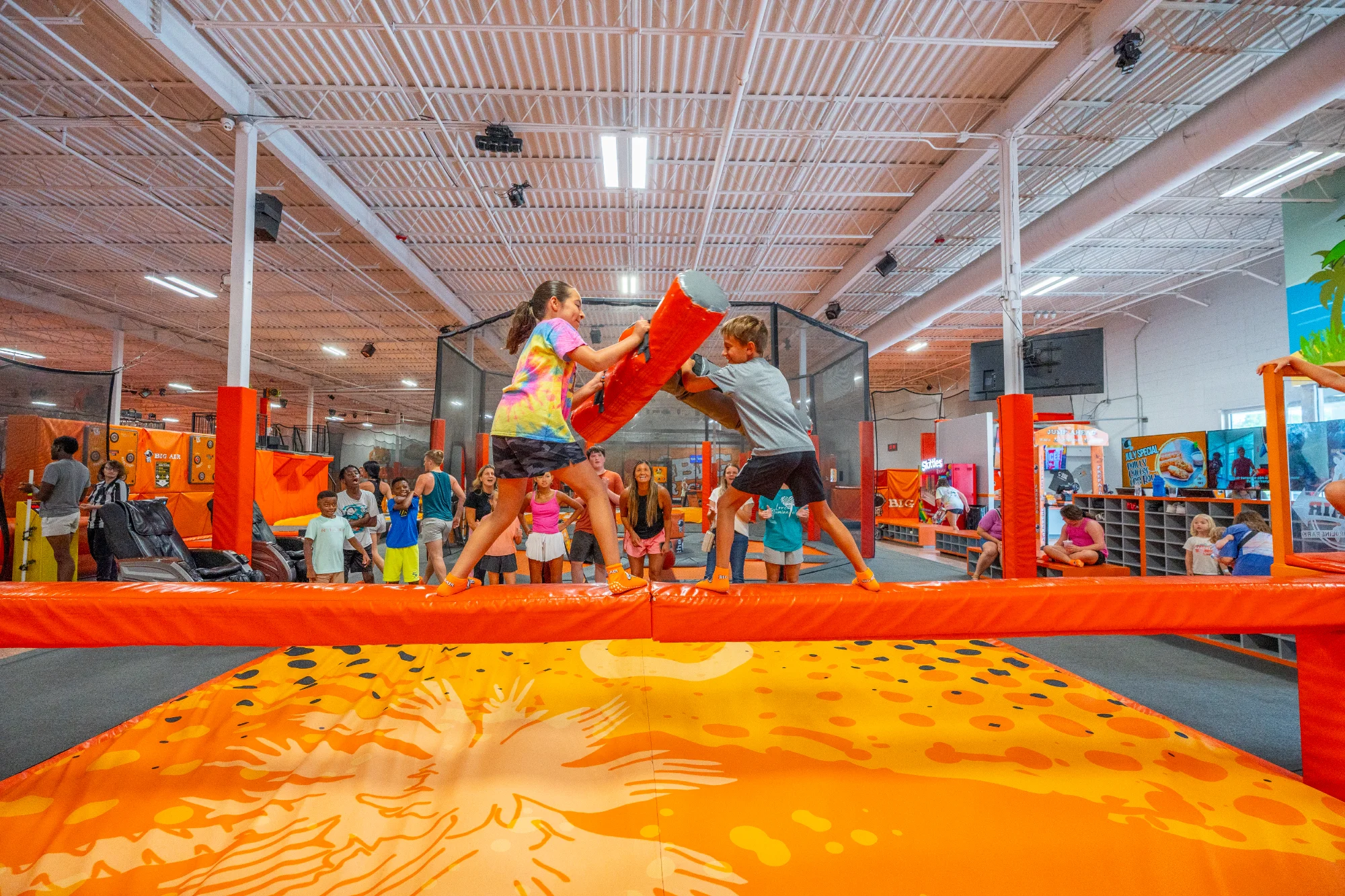 Families jumping at a Big Air trampoline park