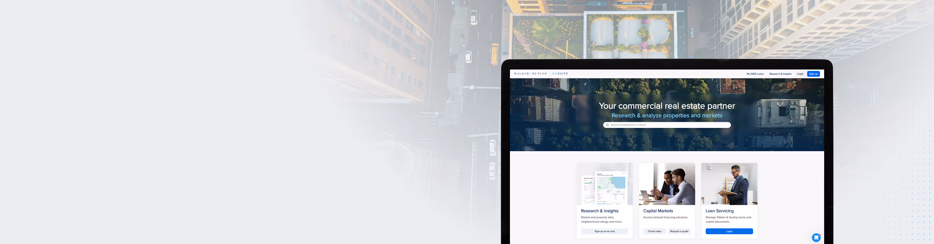 Website screen showing a commercial real estate platform with search bar and options for Research & Insights, Capital Markets, and Loan Servicing.