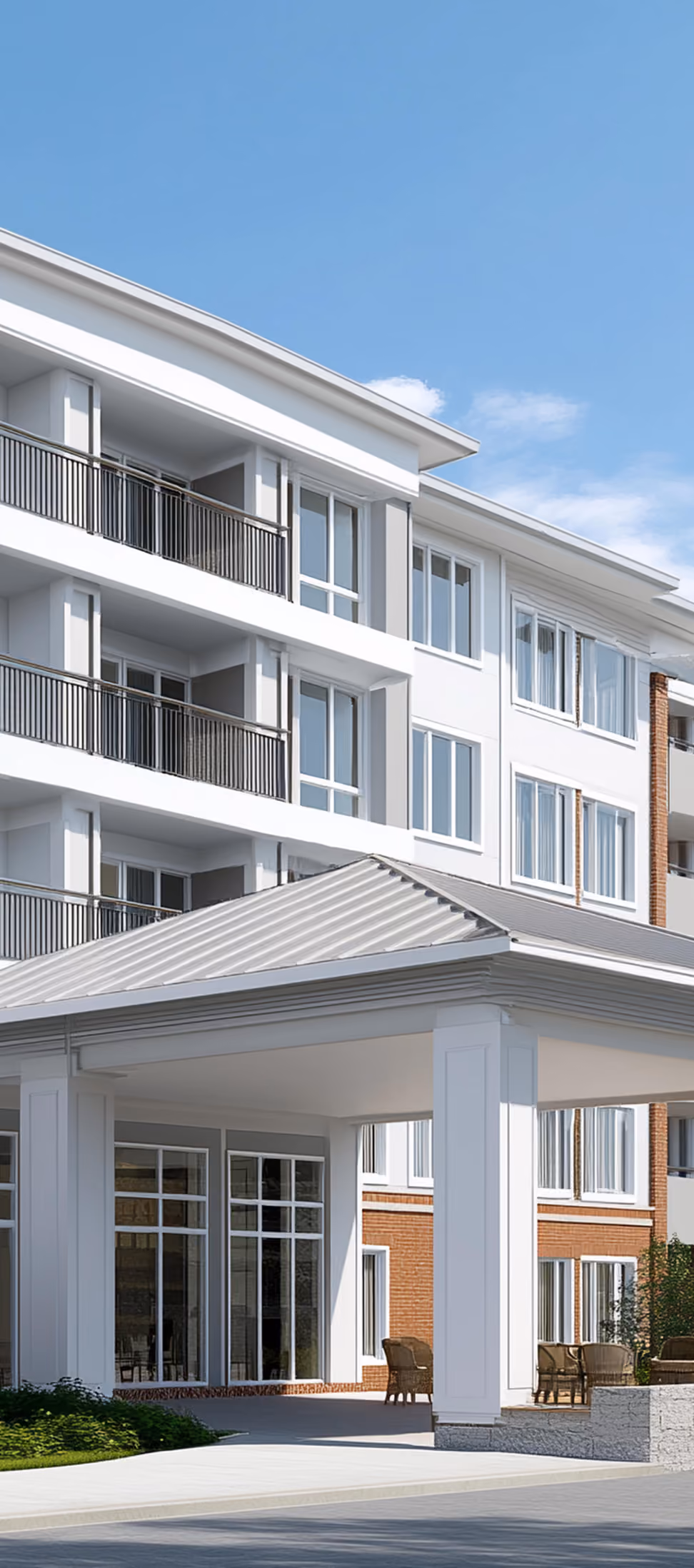 Newly built multi-story seniors housing community with a covered entrance and balconies