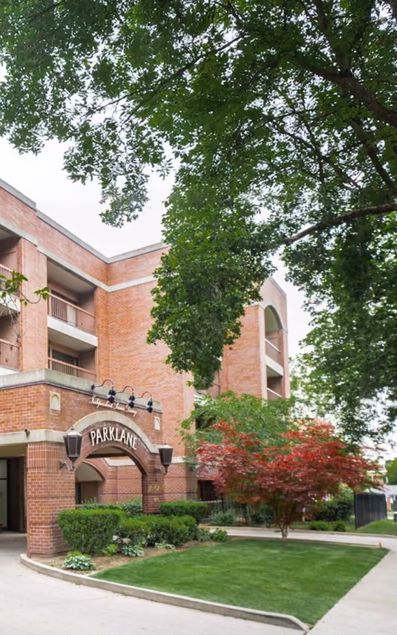 Park Lane Senior Living in Salt Lake City, a brick independent living building with a PARKLANE sign over its arched entrance