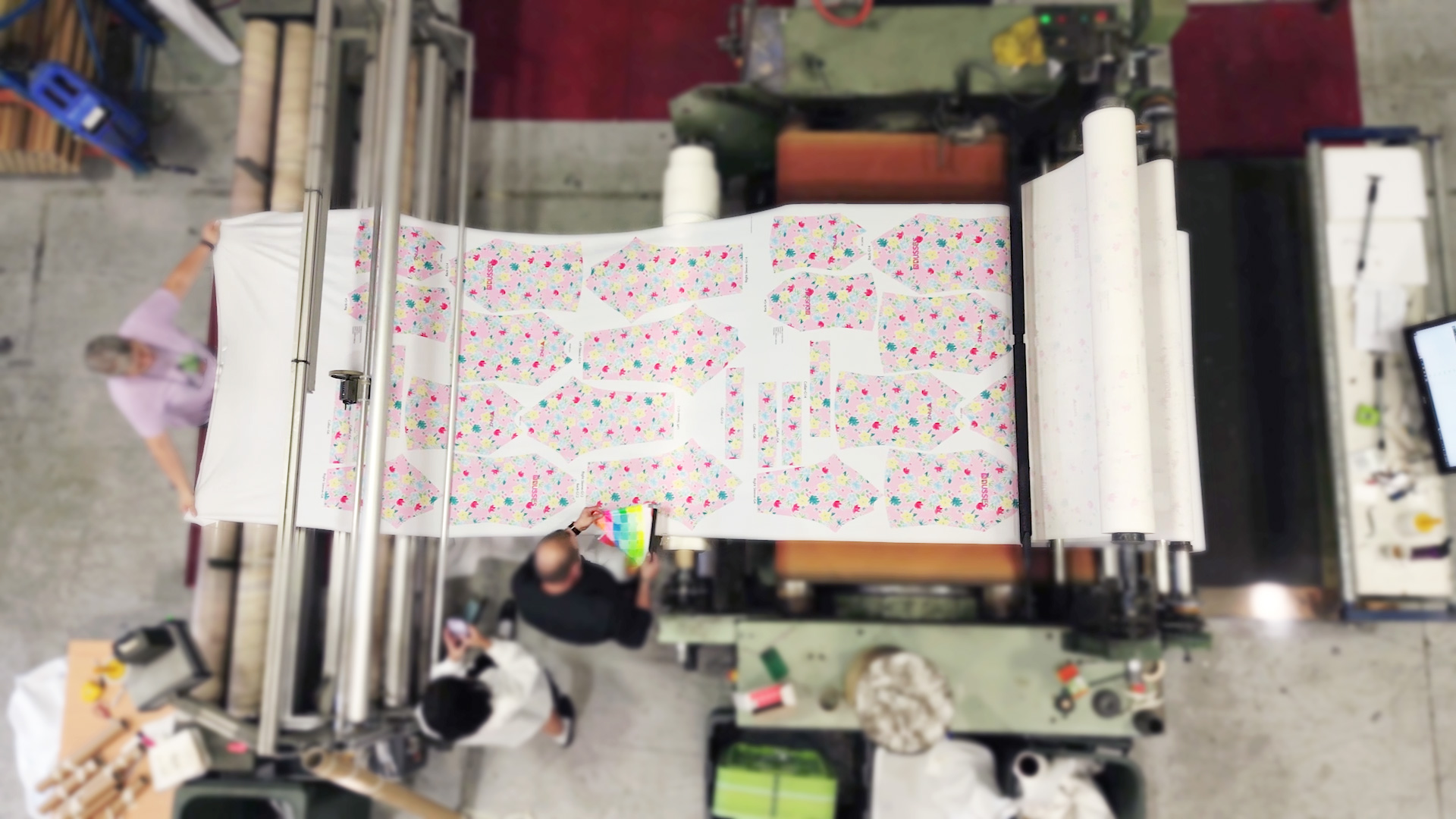 Bird eye view of a calendar machine, sublimation printing swimwear pieces