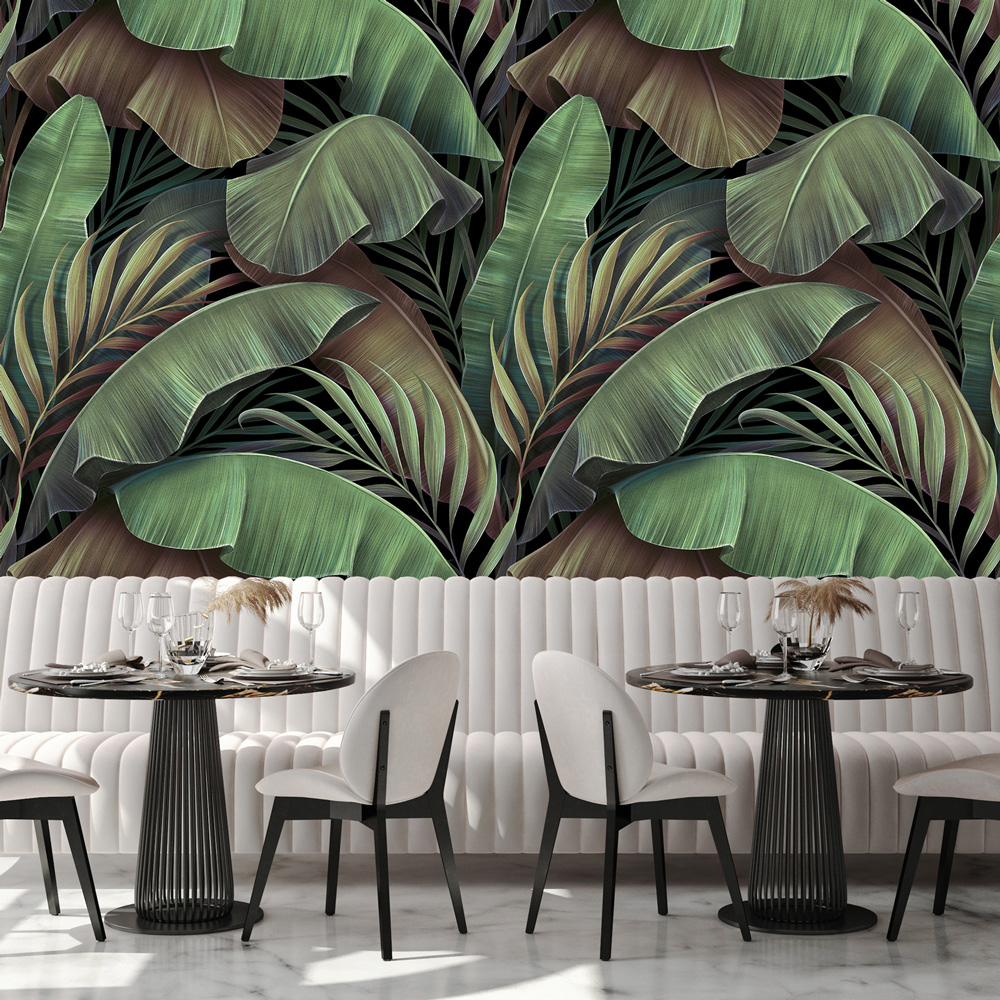 Cafe chairs and booth in front of tropical printed wallpaper