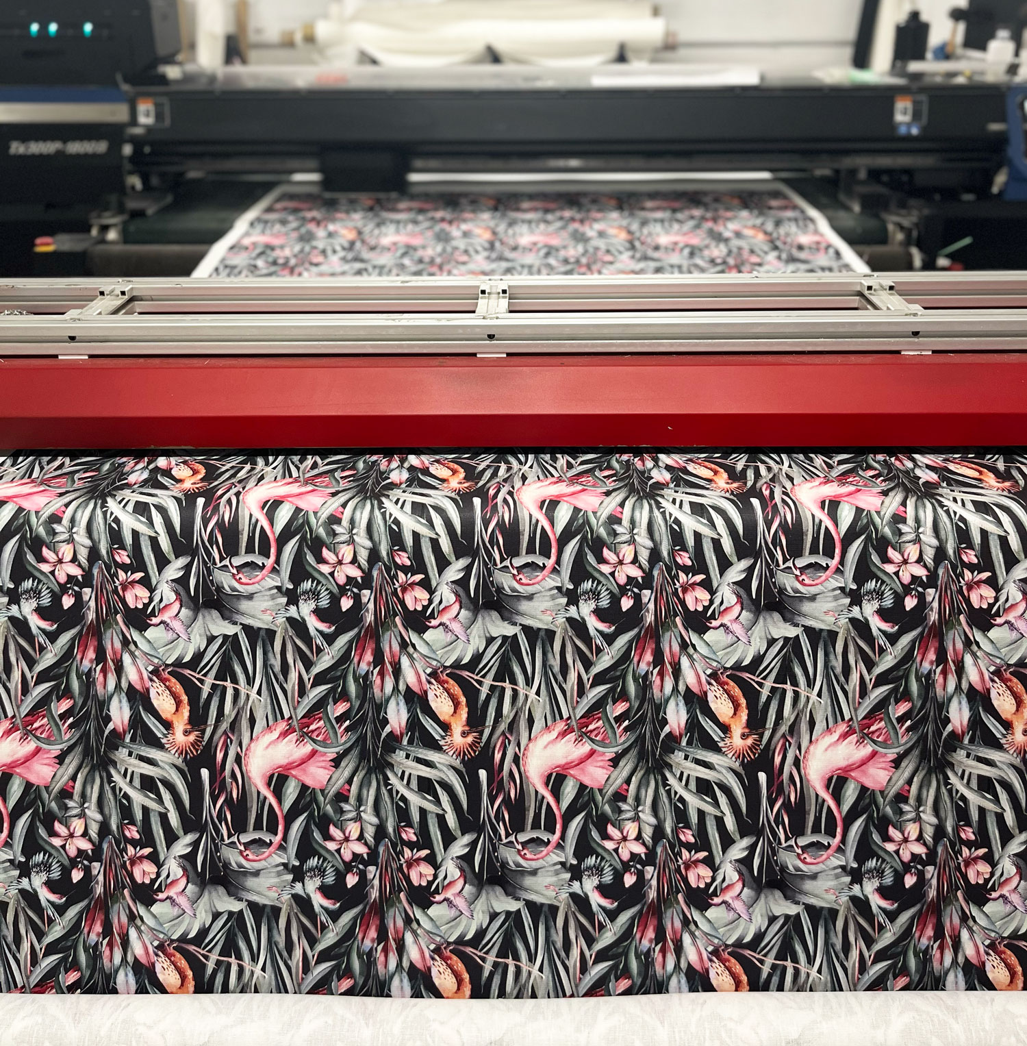 Natural fabrics being printed with a dark tropical design