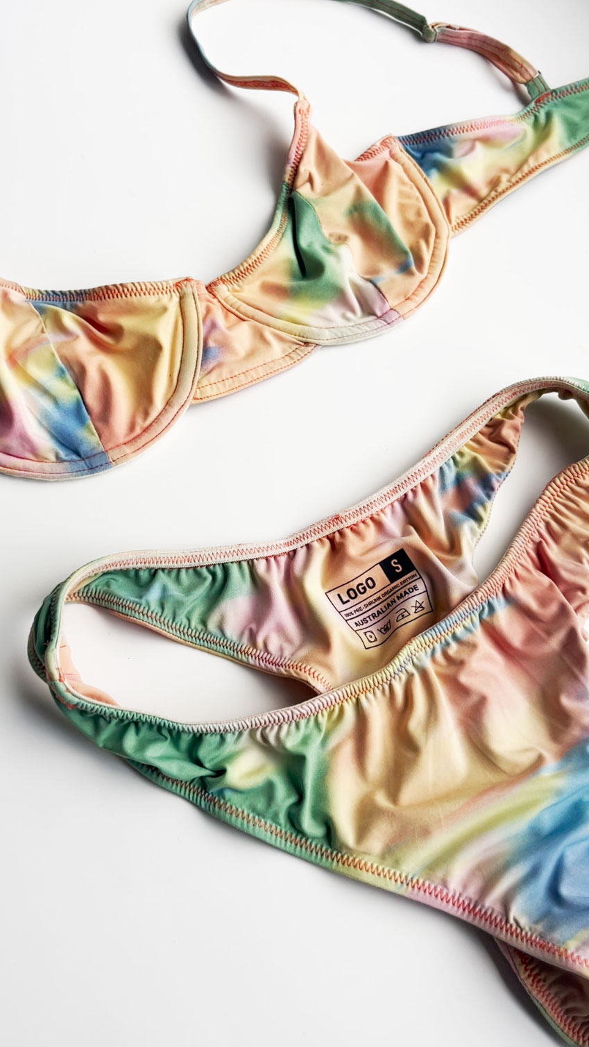 Multi coloured swimsuit with a DTF printed label inside