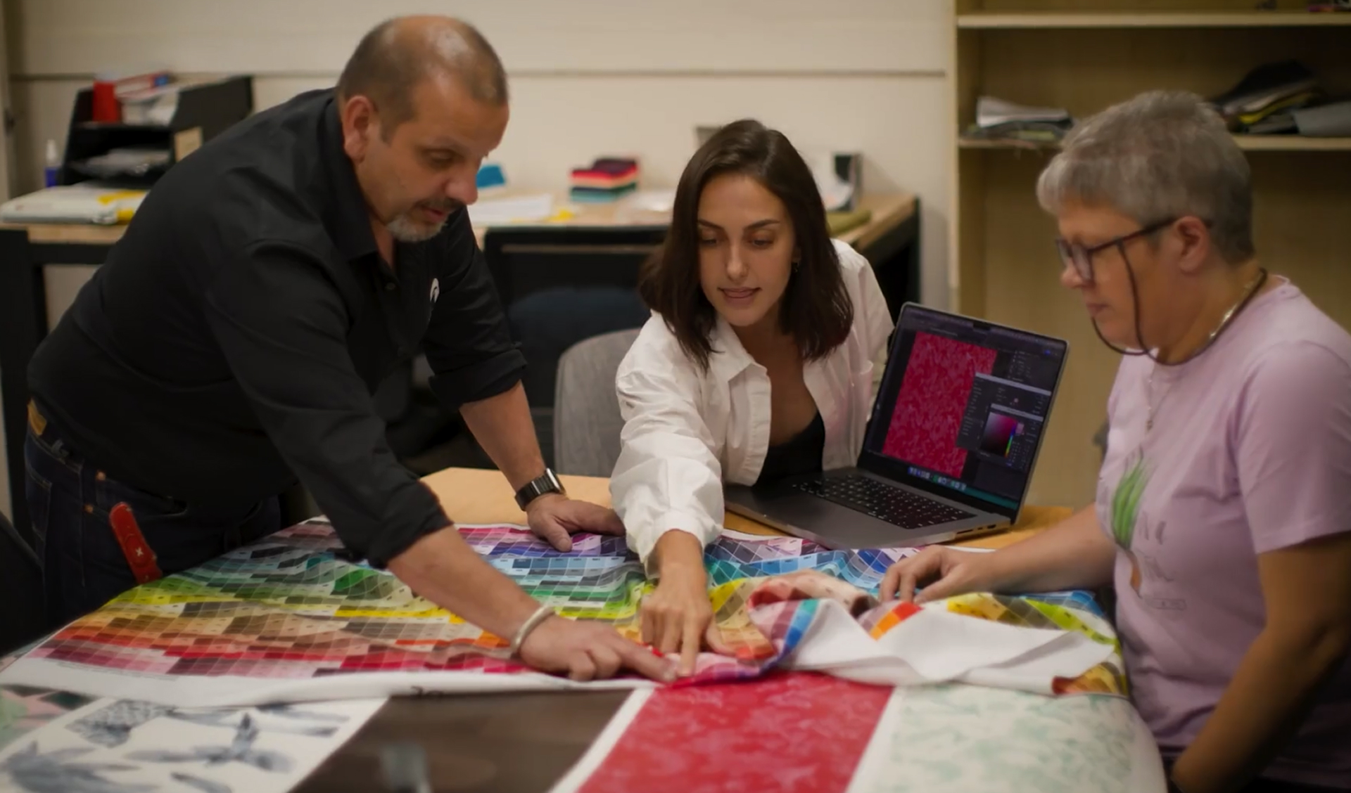 Joe, Bindi and Kiara from Mereton discussing swatches and colour samples