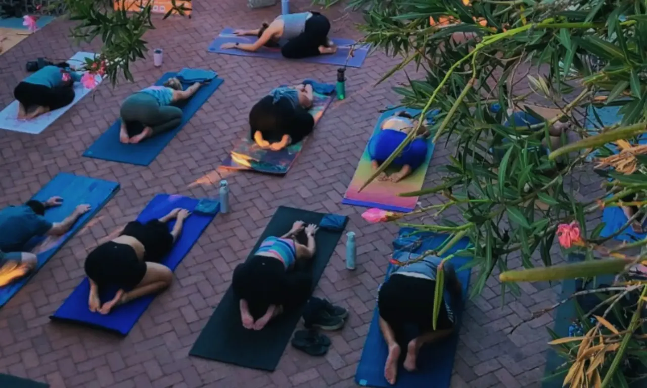 Yoga Pod Tucson class practicing outdoors