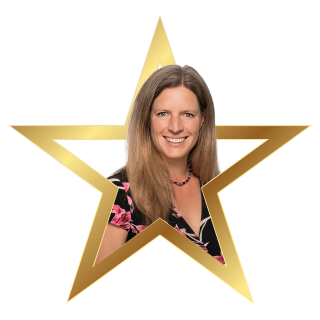 Smiling woman with long light brown hair wearing a black top with pink floral pattern, framed inside a golden star outline.