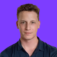 Portrait of a young man with short curly brown hair, wearing a dark polo shirt, on a purple background.