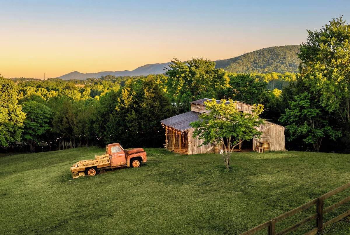 Private Pond Cabin rustic barn with mountain views and vintage truck