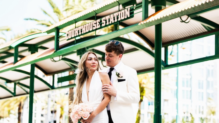 Couple embraces in a candid moment after their courthouse wedding ceremony.