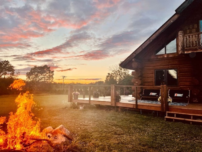Modern Scandinavian-style cabin with vaulted wood ceiling and large windows at a Michigan VRBO wedding venue