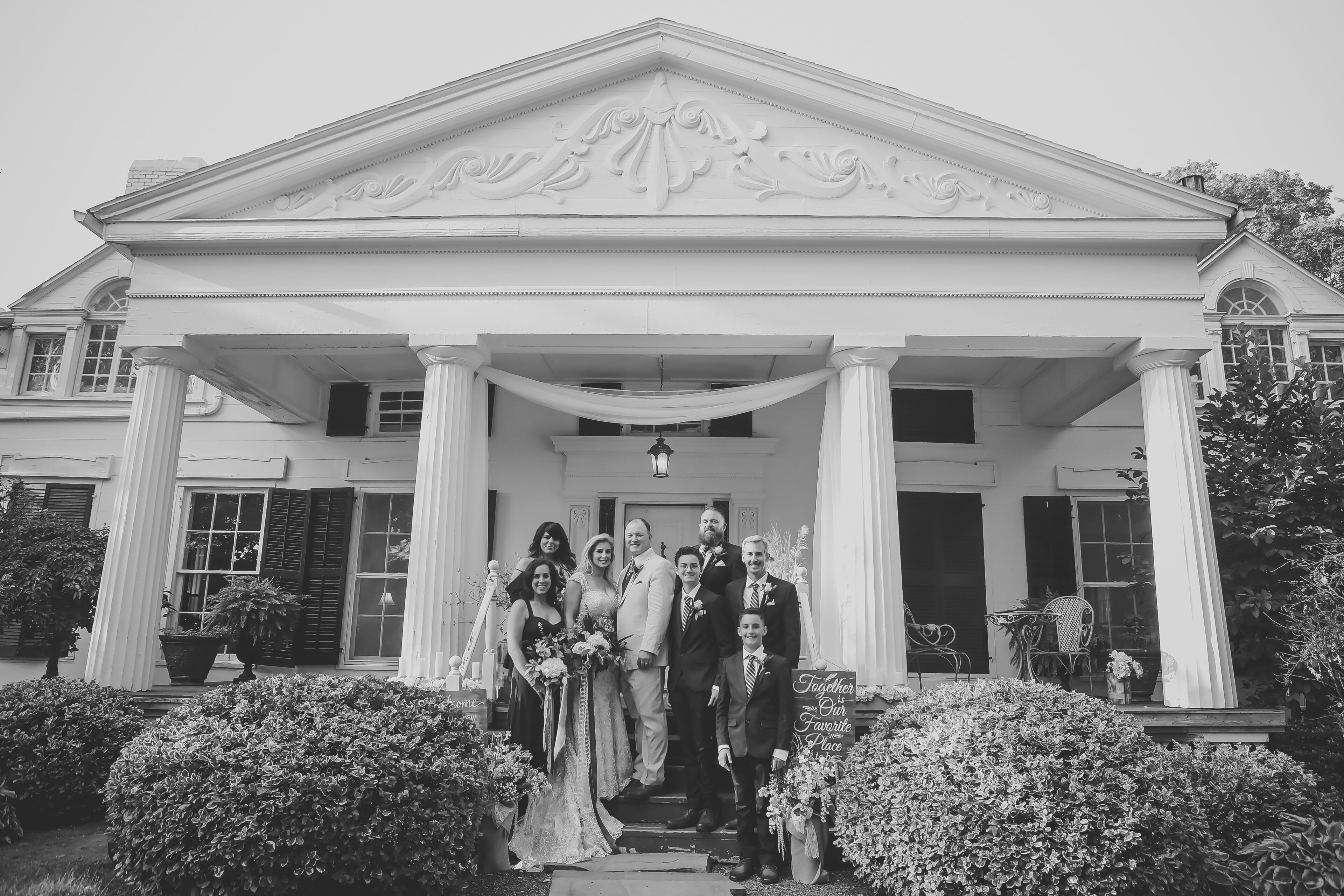 White-columned Greek Revival mansion at a Niagara Falls VRBO wedding venue, with a wide front lawn