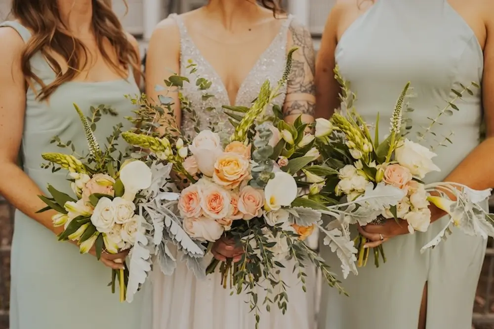 garden rose and dusty miller bridal bouquet with peach tones and soft greenery