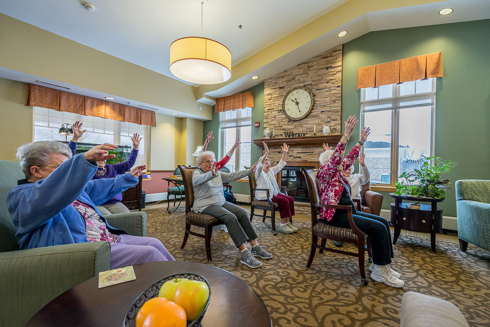 Elders doing chair exercises with music at a Mt Vernon nursing home.