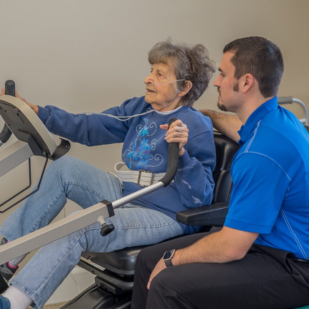 A physical therapist at the Moreland Hughes Rehabilitation Center in Mt. Vernon guides a woman through physical therapy.
