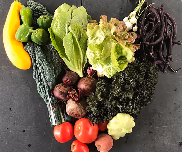 CSA share option, a variety of fresh local produce and eggs