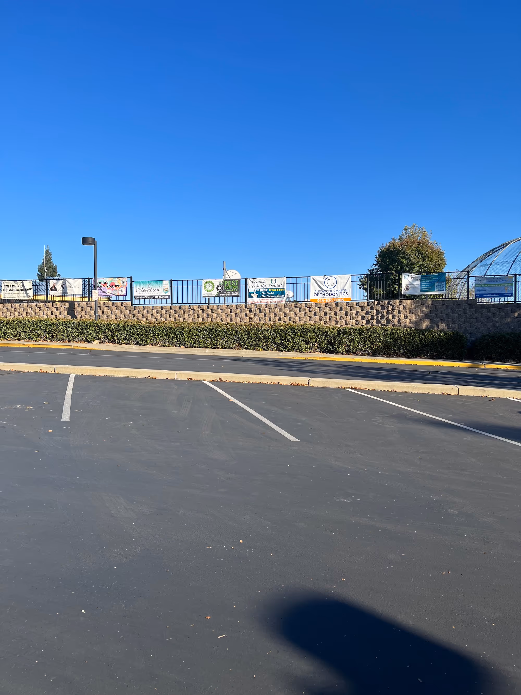 Banners hanging along a school fence