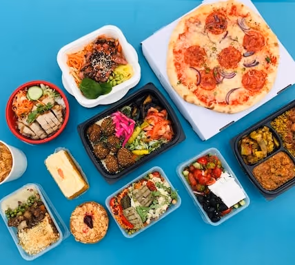 A variety of lunch foods sitting on a table.