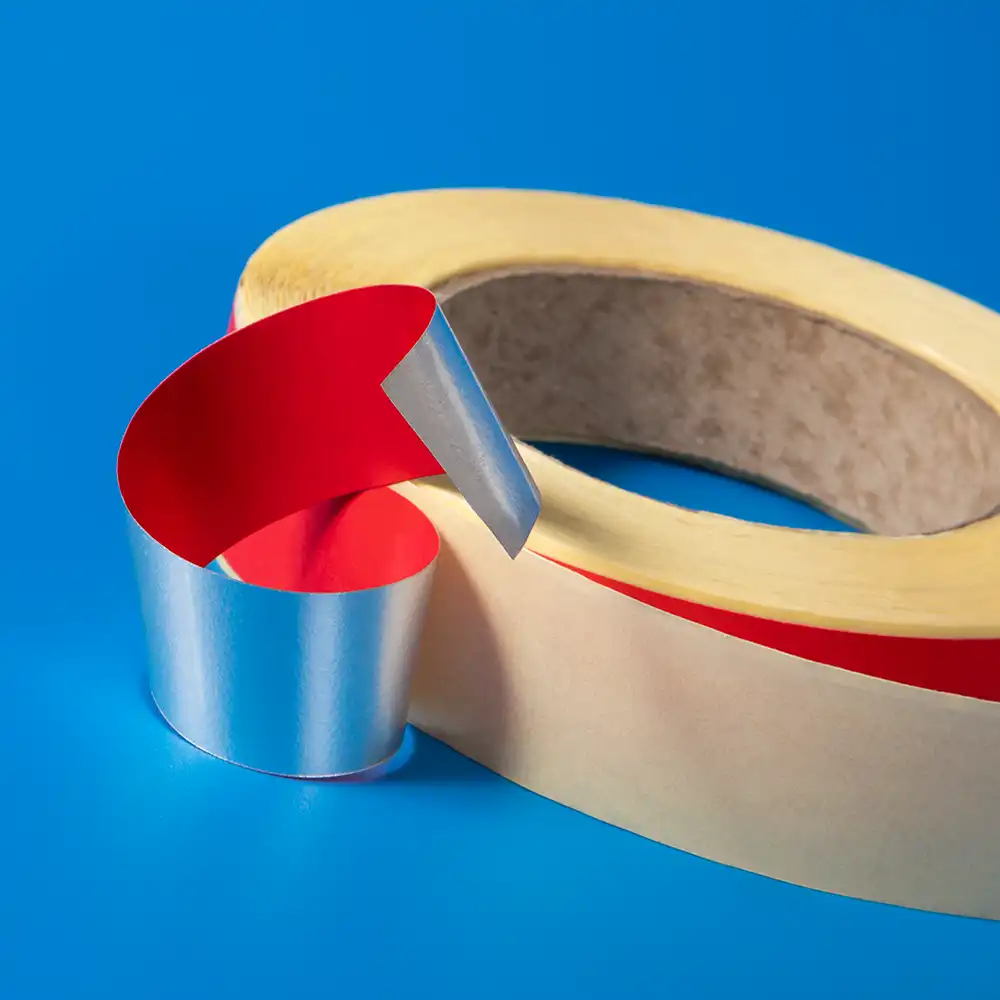 A roll of coloured metal detectable self-adhesive tape for use in the food production industry