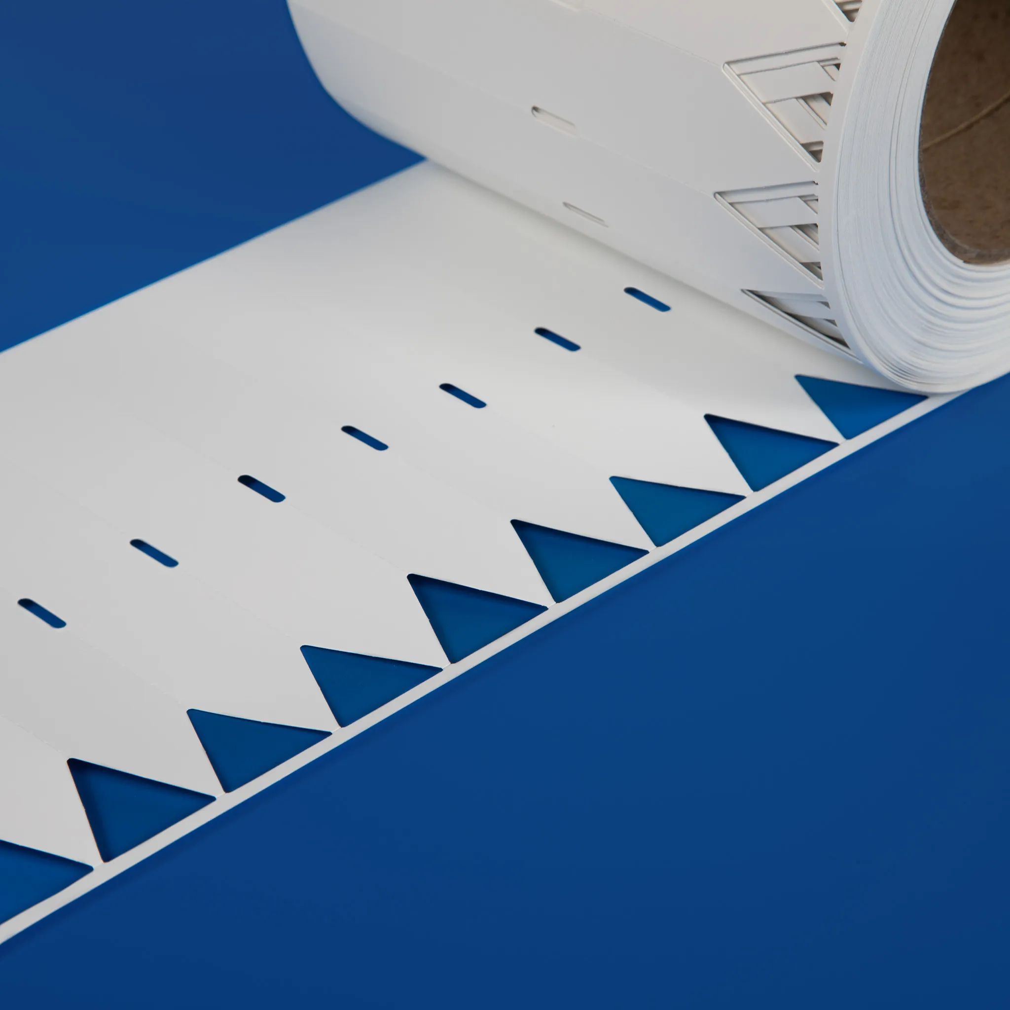 Thermal transfer printable stick in labels on a roll