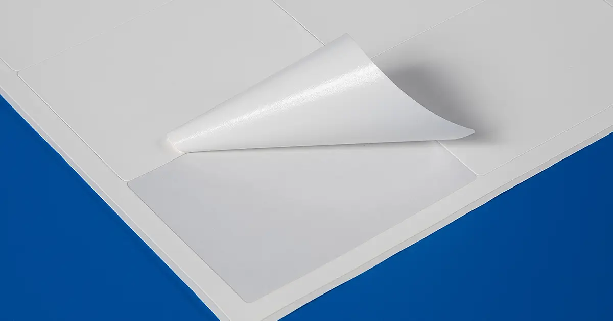 Synthetic self-adhesive labels on sheets for use with a laser printer such as the OKI C650.