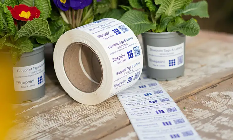 Post consumer recycled self-adhesive plant labels on a roll for thermal transfer printing