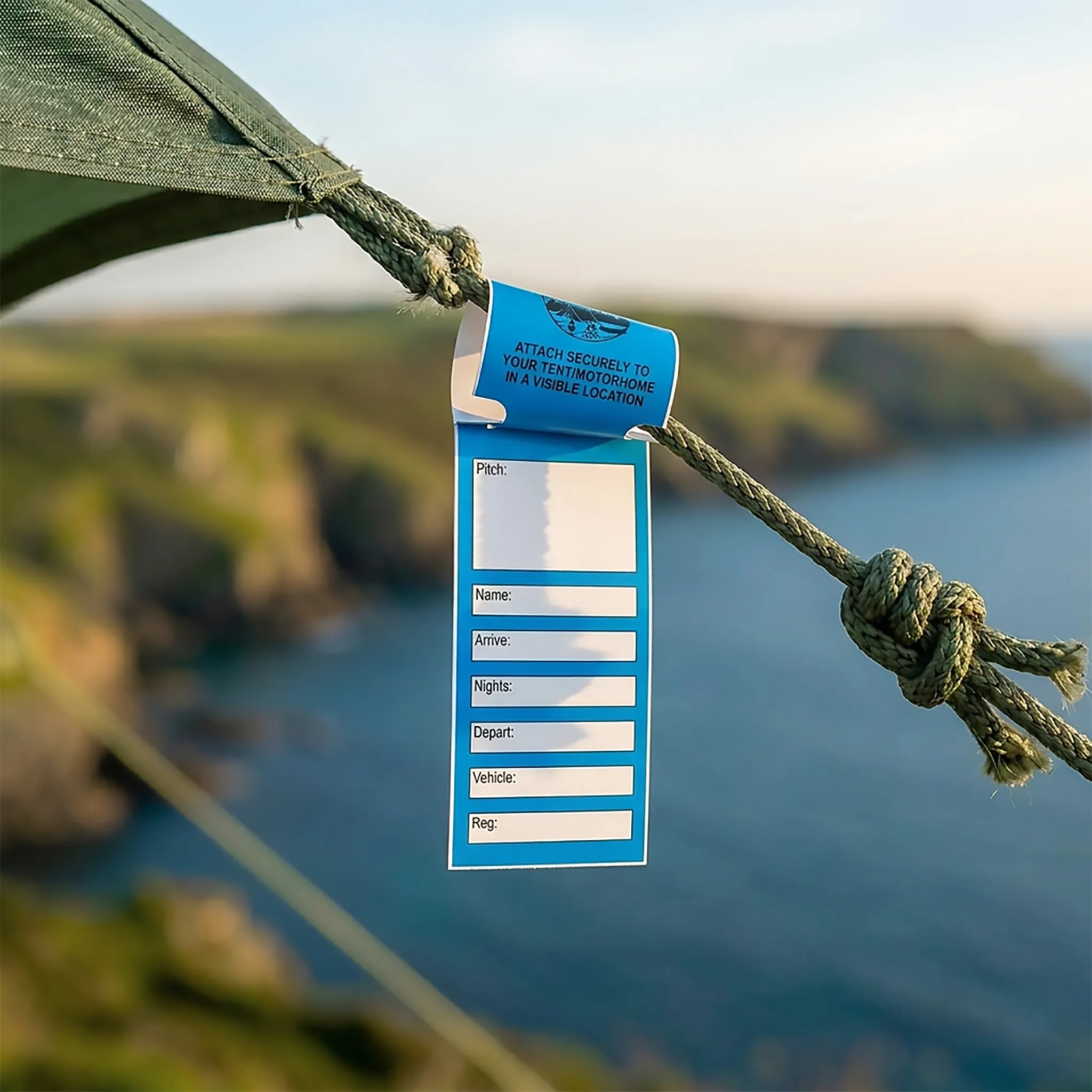 A self-tie tent tag at a coastal campsite