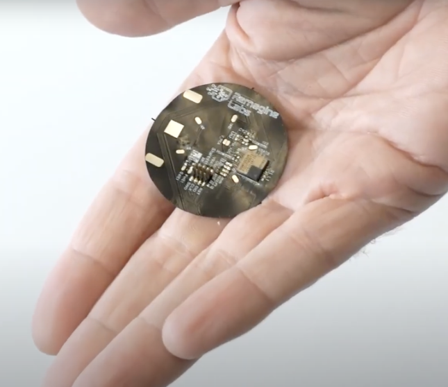 A hand holding a small circular objectAI-generated content may be incorrect.