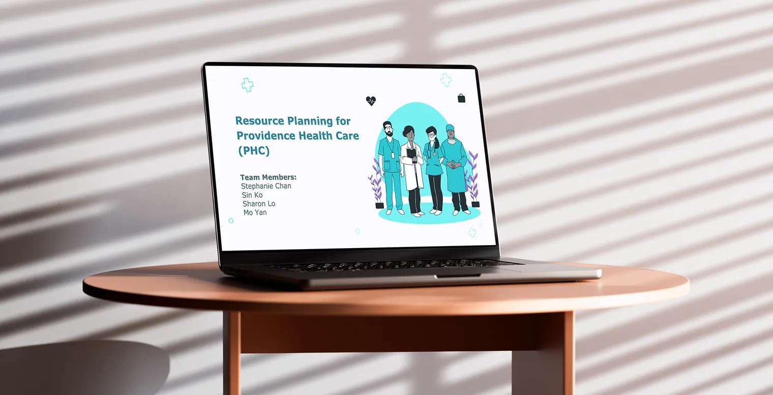 A laptop sits on a round wooden table displaying a presentation slide titled “Resource Planning for Providence Health Care (PHC)” with an illustration of four diverse healthcare professionals. The slide lists team members: Stephanie Chan, Sin Ko, Sharon Lo, and Mo Yan. Sunlight creates striped shadows across the background wall.