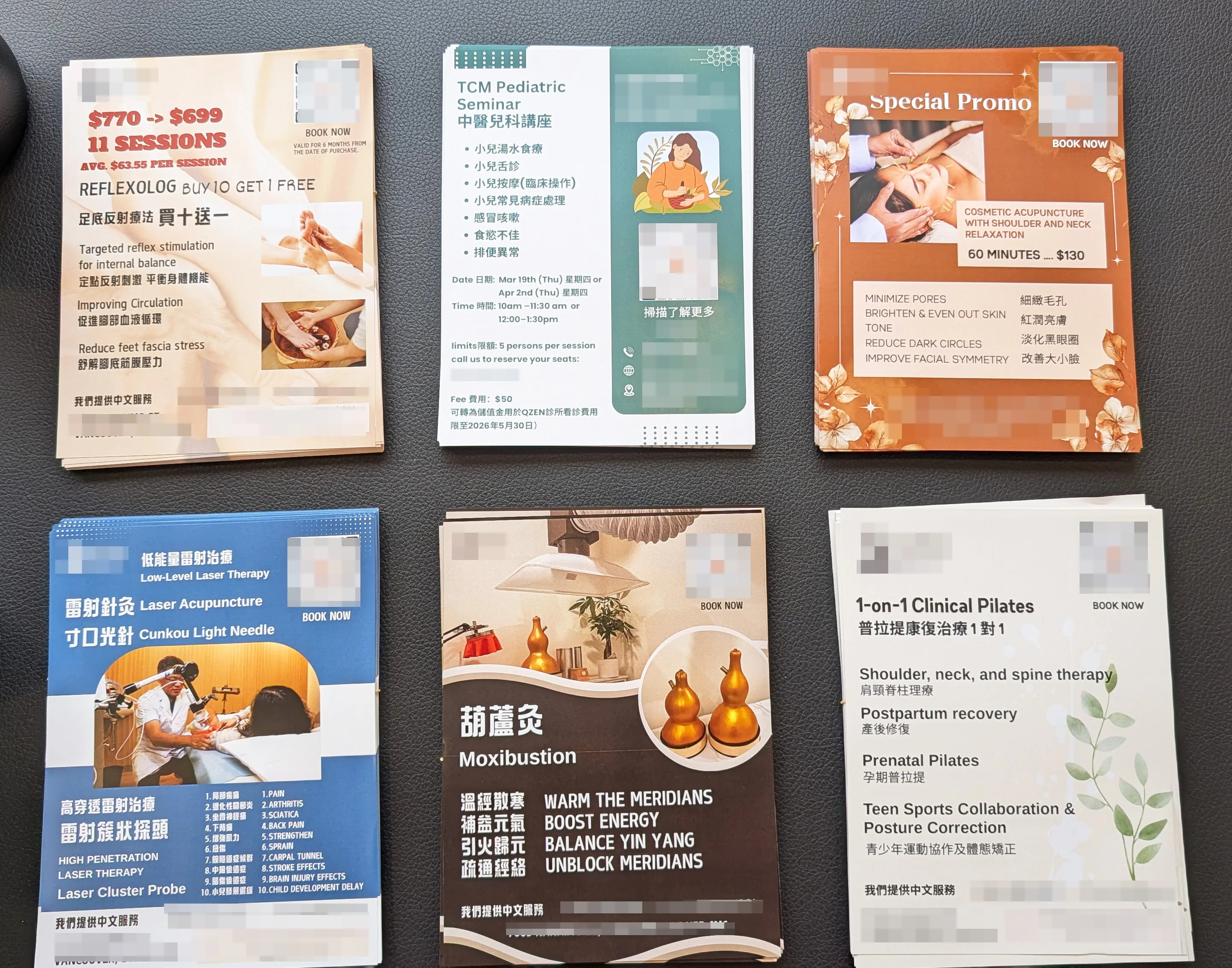 Stacks of promotional leaflets for health therapies including reflexology, pediatric seminar, cosmetic acupuncture, low-level laser therapy, moxibustion, and clinical Pilates on a dark surface.