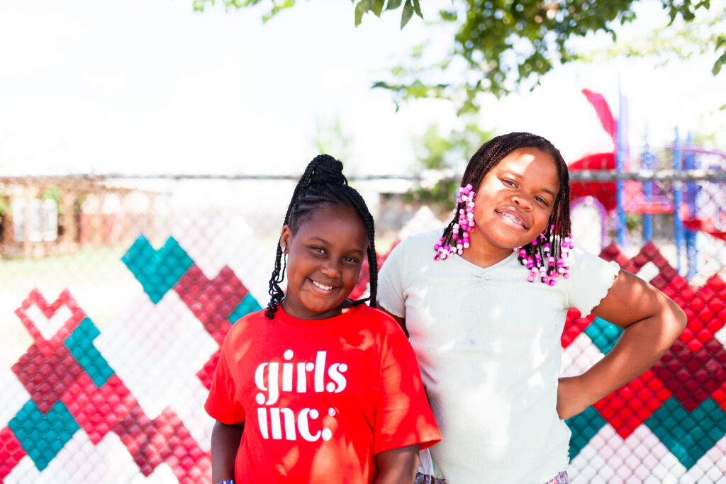 Two girls pictured outdoors on the Girls Inc. of Metropolitan Dallas website.