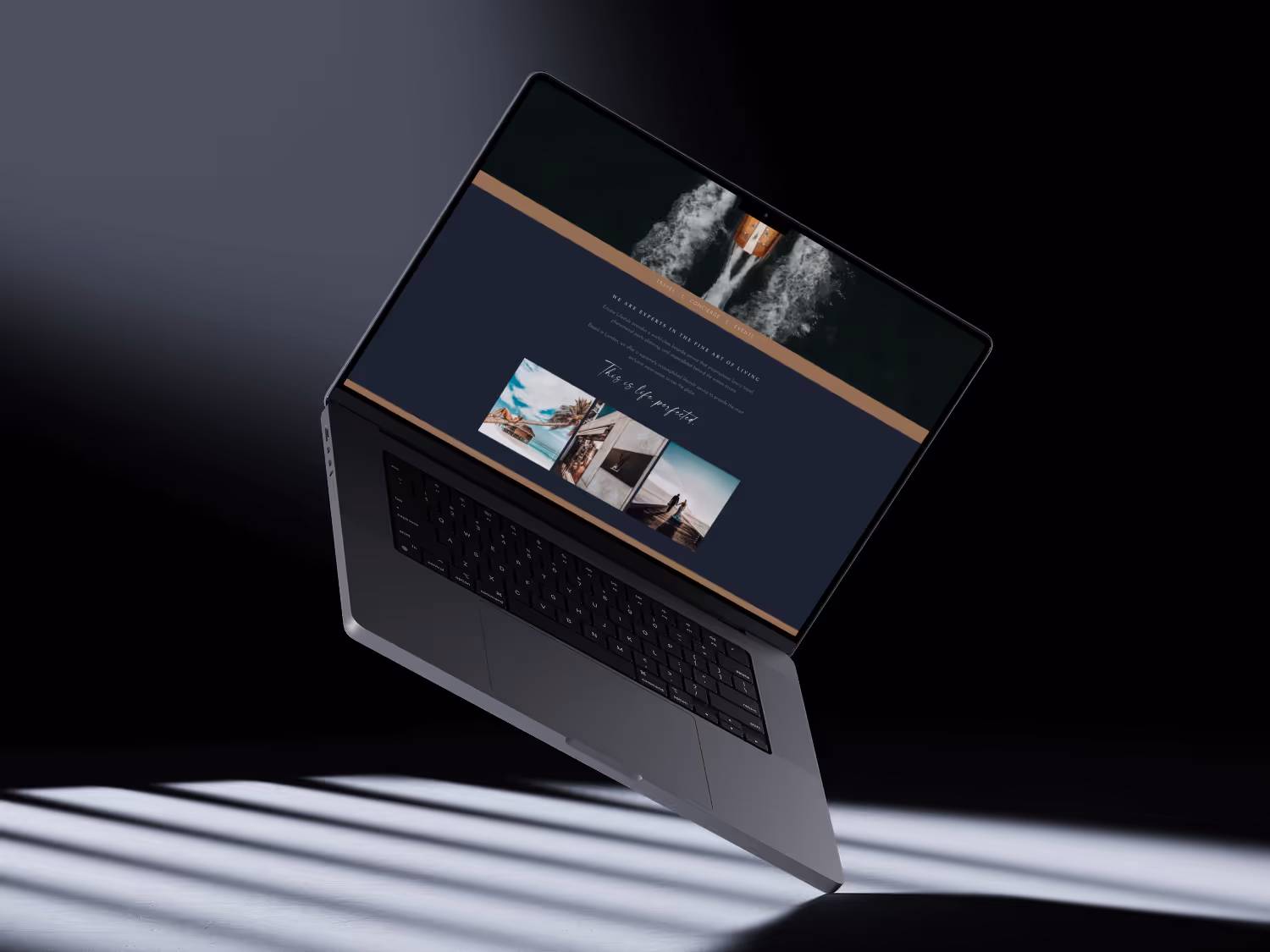 Floating MacBook Pro displaying a website with images and text against a dark background with shadow stripes on the surface below.