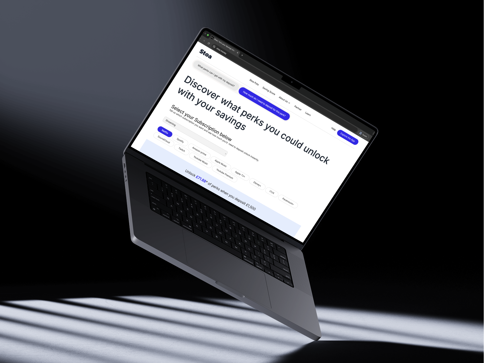 Open laptop displaying a webpage titled 'Discover what perks you could unlock with your savings' with subscription options from streaming services like Netflix, Spotify, and Disney+.