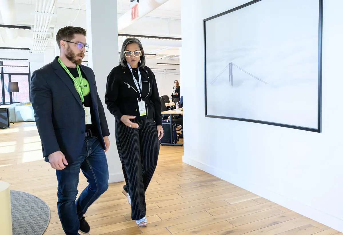Colleagues walking through the Instead office