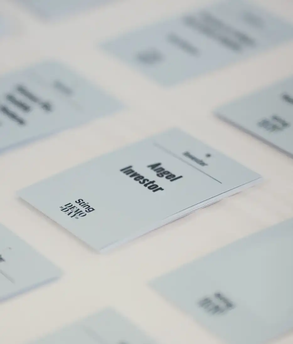 A name badge with "Angel investor"