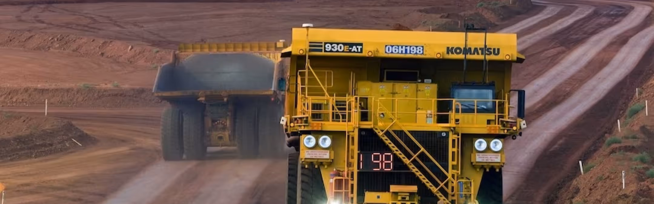 Large yellow mining dump truck in quarry operation requiring heavy-duty torque equipment